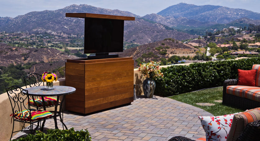 Backyard TV lift cabinet hides 55 inch TV & sound bar made out of Cumaru IPE Poway California Cabinet Tronix