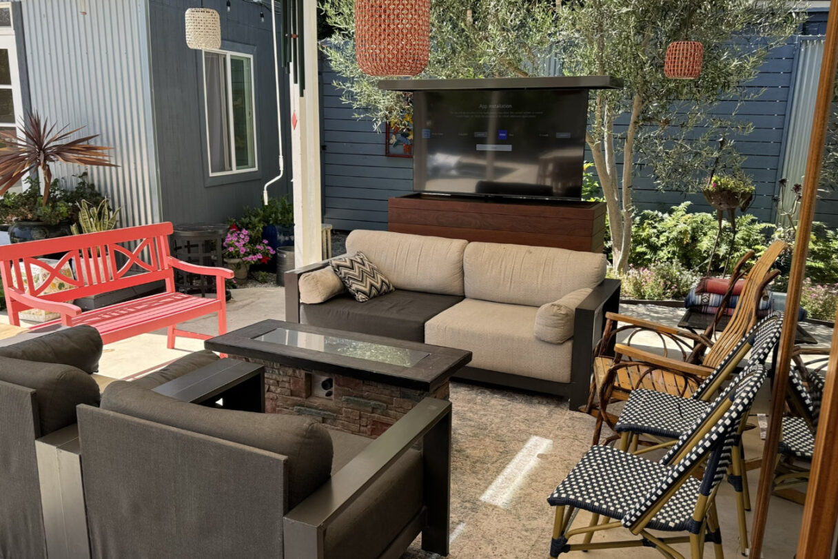 outdoor tv lift cabinet hides tv behind couch